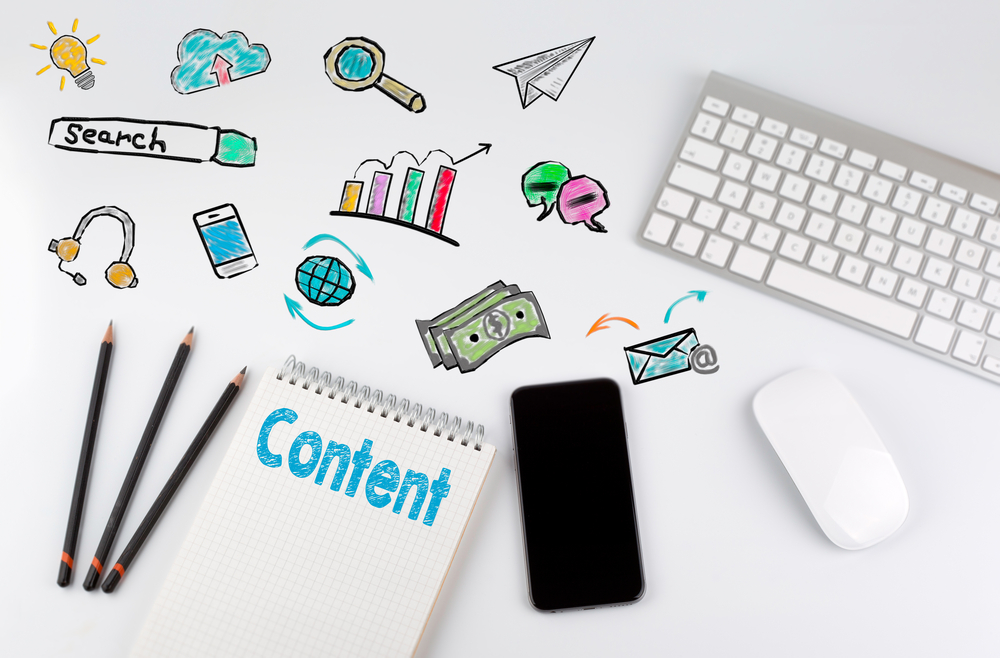 Content concept. Office desk table with computer, Smartphone, note pad, pencils